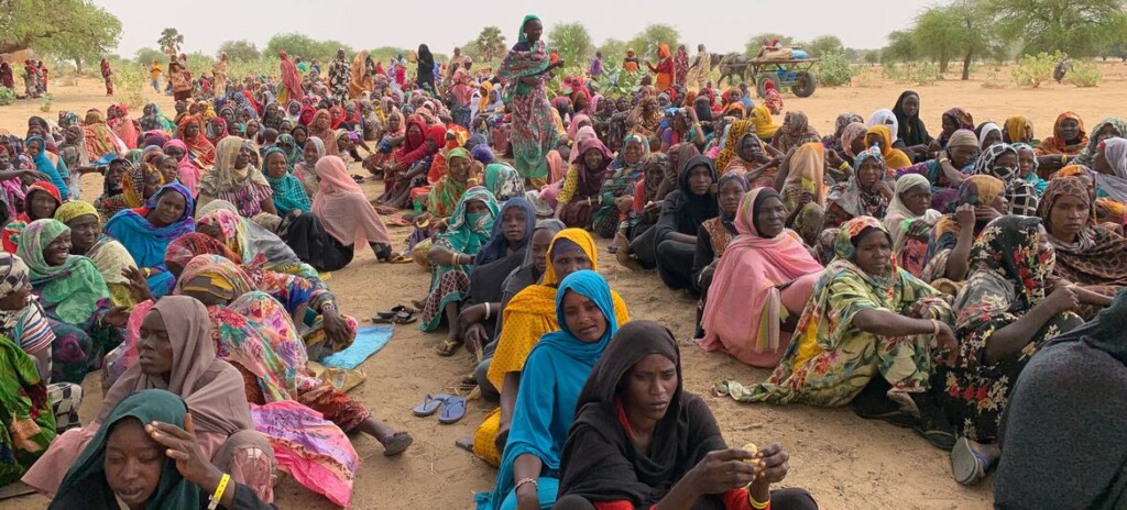Sudanese refugees awaiting aid distribution in Chad, near the border with Sudan (source: UN).